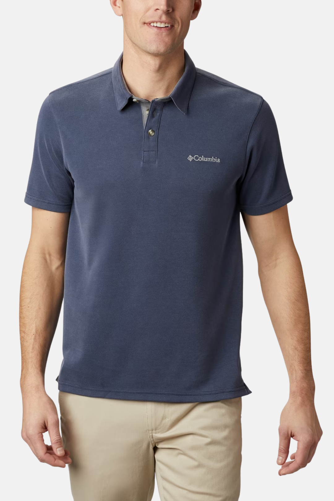 Columbia polo shirt in collegiate navy, short sleeves, button placket, chest logo.