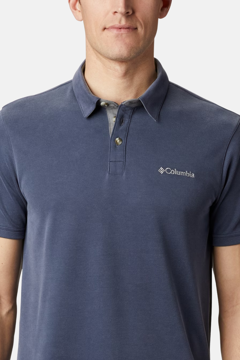 Columbia polo shirt in collegiate navy with button collar and chest logo.