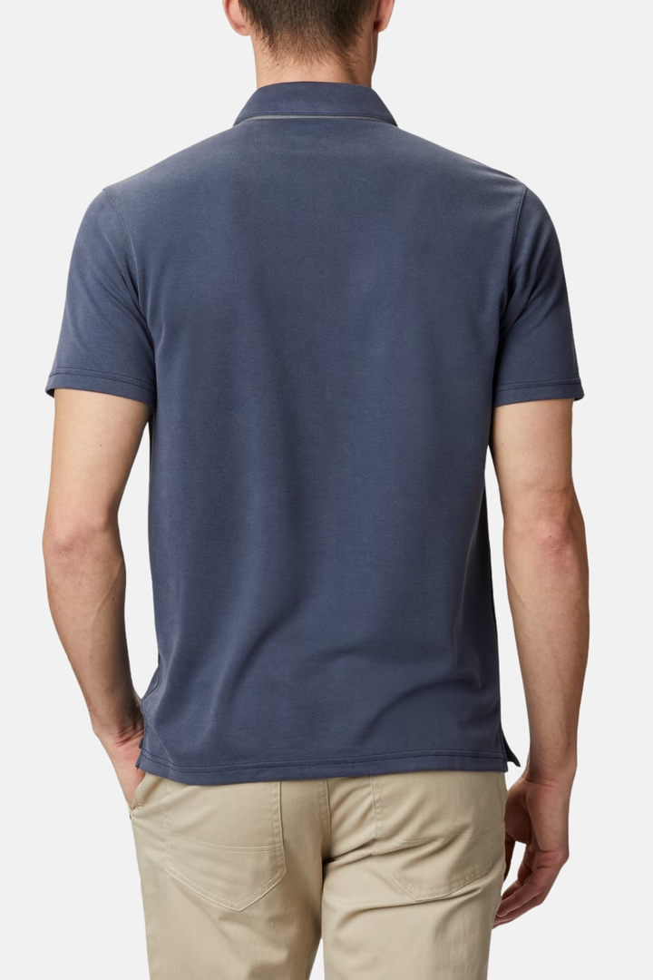 Columbia navy polo shirt, back view with short sleeves and curved hem.