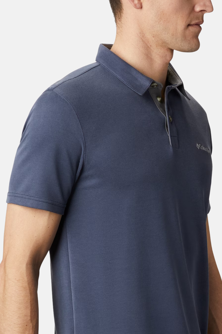 Columbia collegiate navy polo shirt with buttoned collar and small sleeve logo.