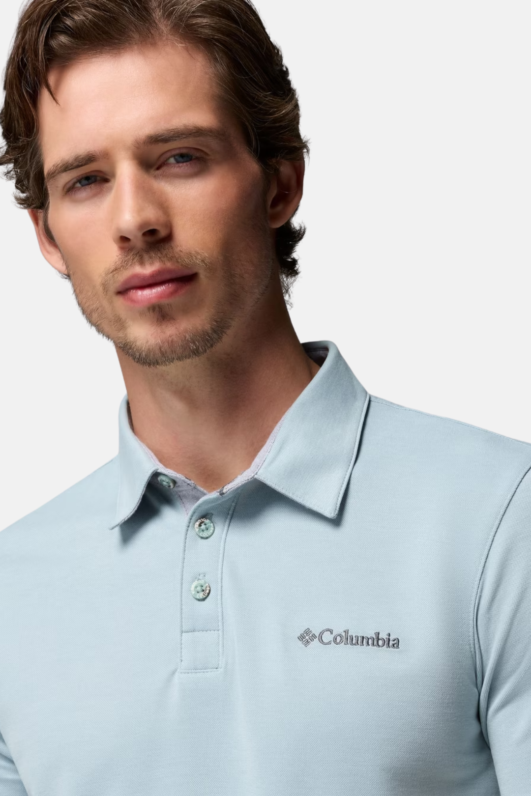 Men's light blue Columbia polo shirt with spread collar and buttoned placket