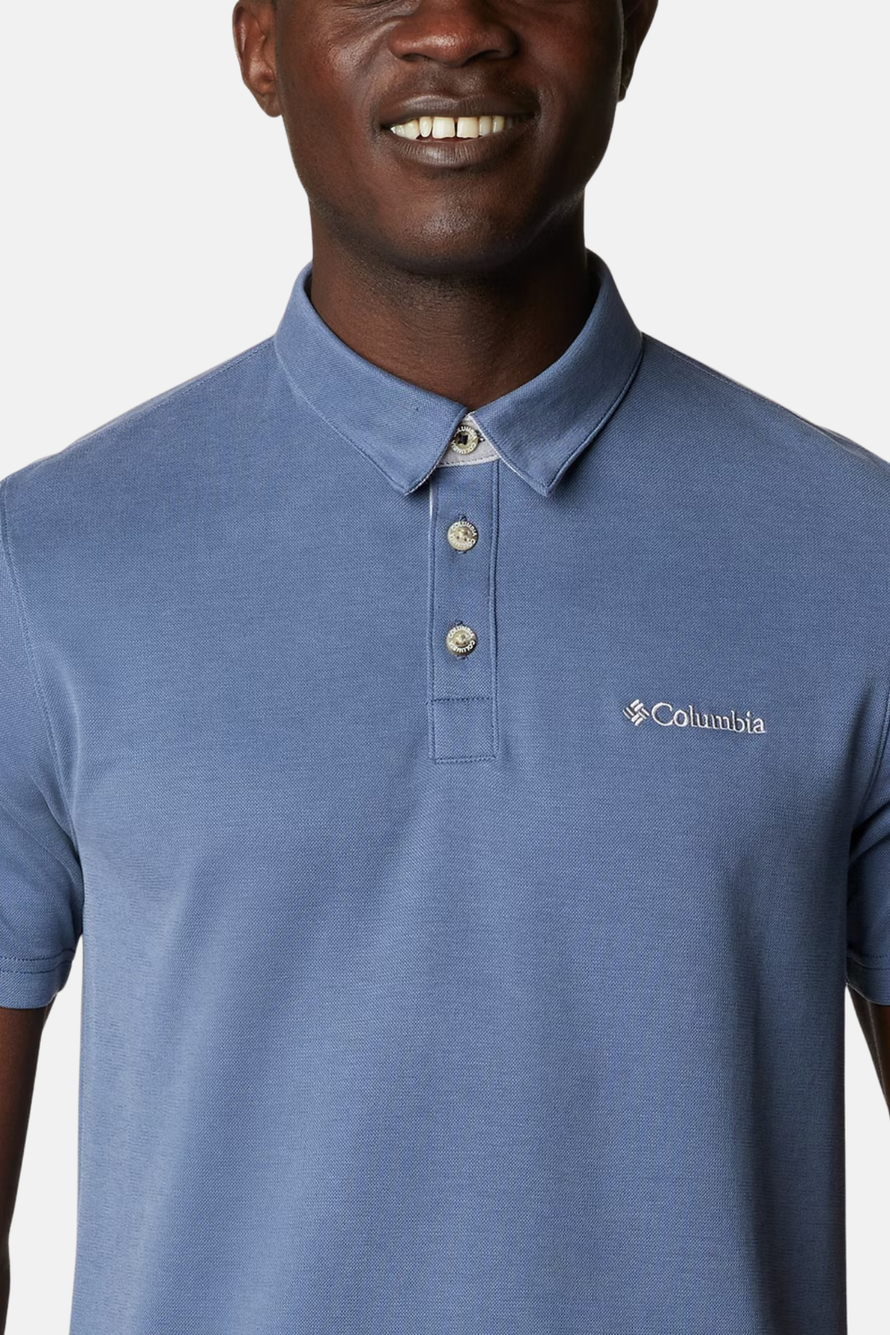 Blue polo shirt with three-button placket and Columbia logo on left chest
