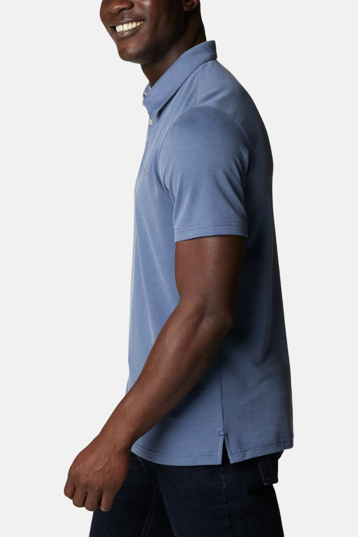 Blue polo shirt side profile with buttoned collar and Columbia logo