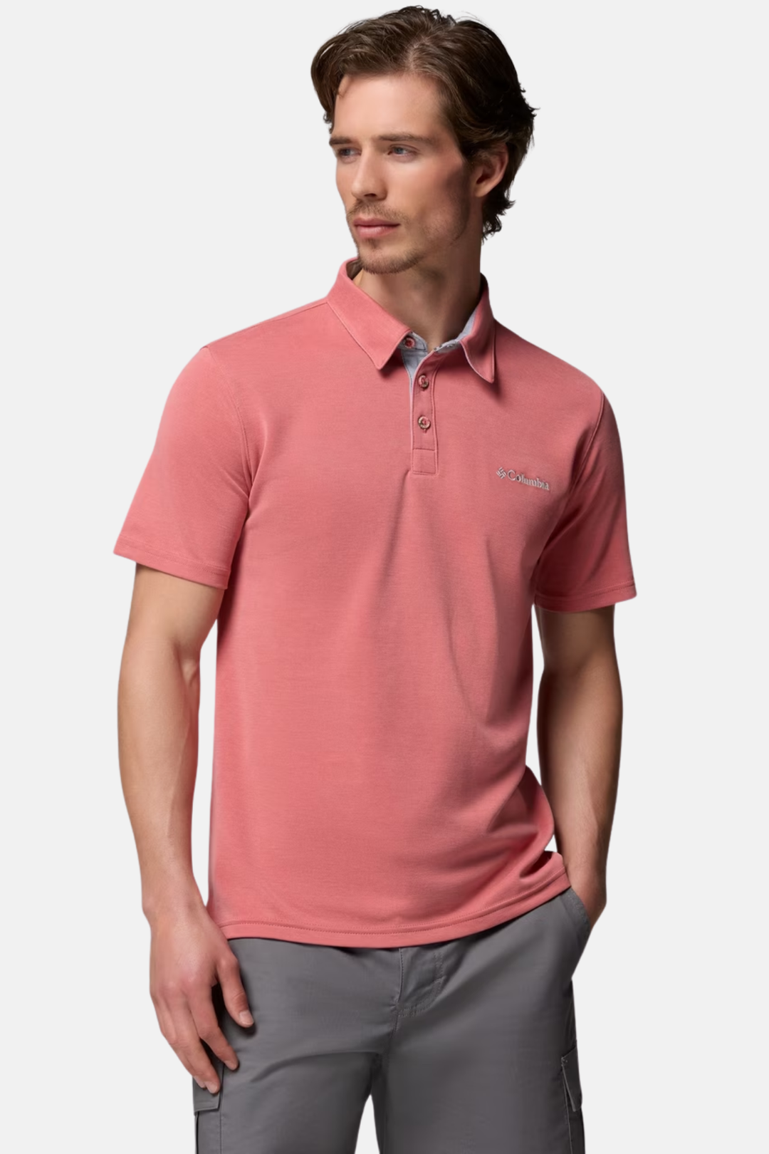 Washed red polo shirt with buttoned collar, short sleeves, chest logo