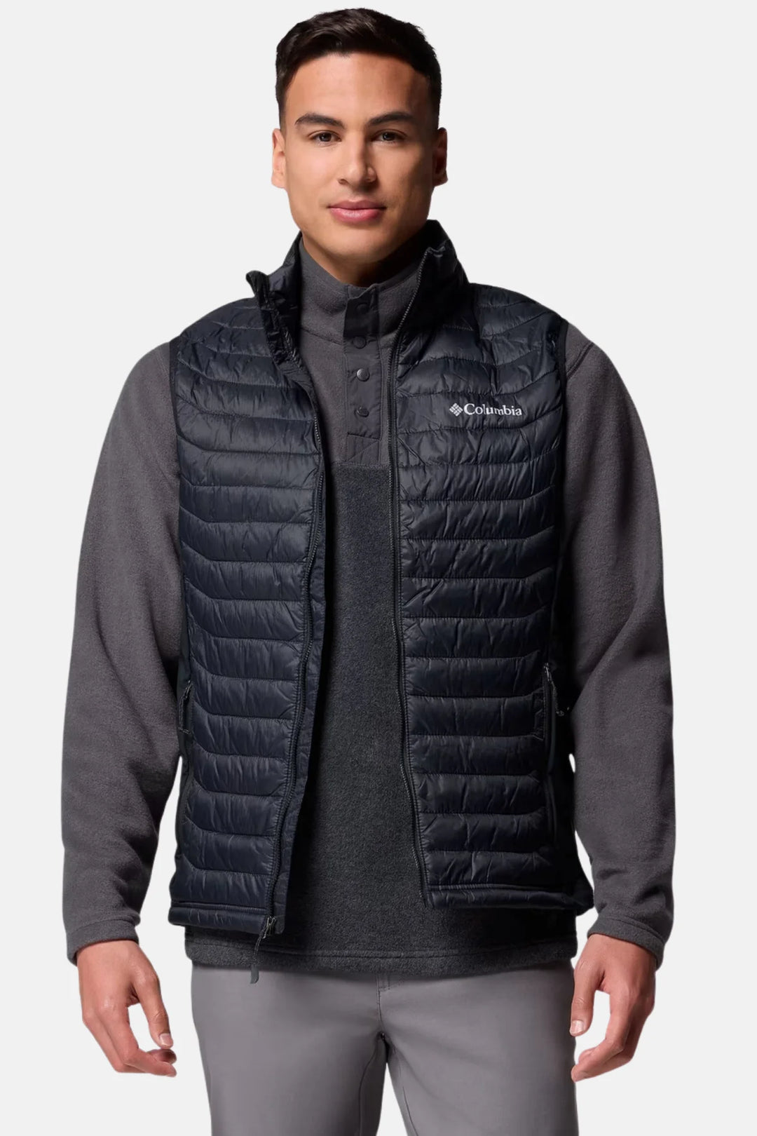 Black Columbia puffer vest with full zipper and stand collar over long sleeves