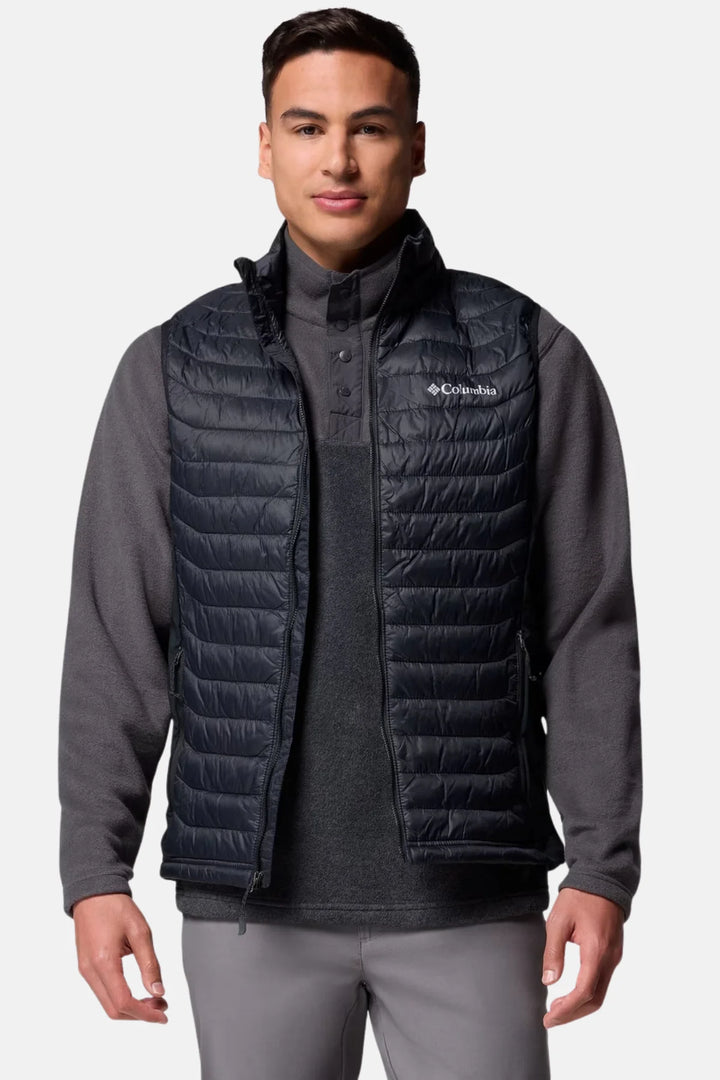 Black Columbia puffer vest with full zipper and stand collar over long sleeves