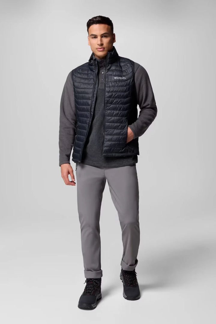 Black quilted puffer vest with full-zip front and stand collar on model