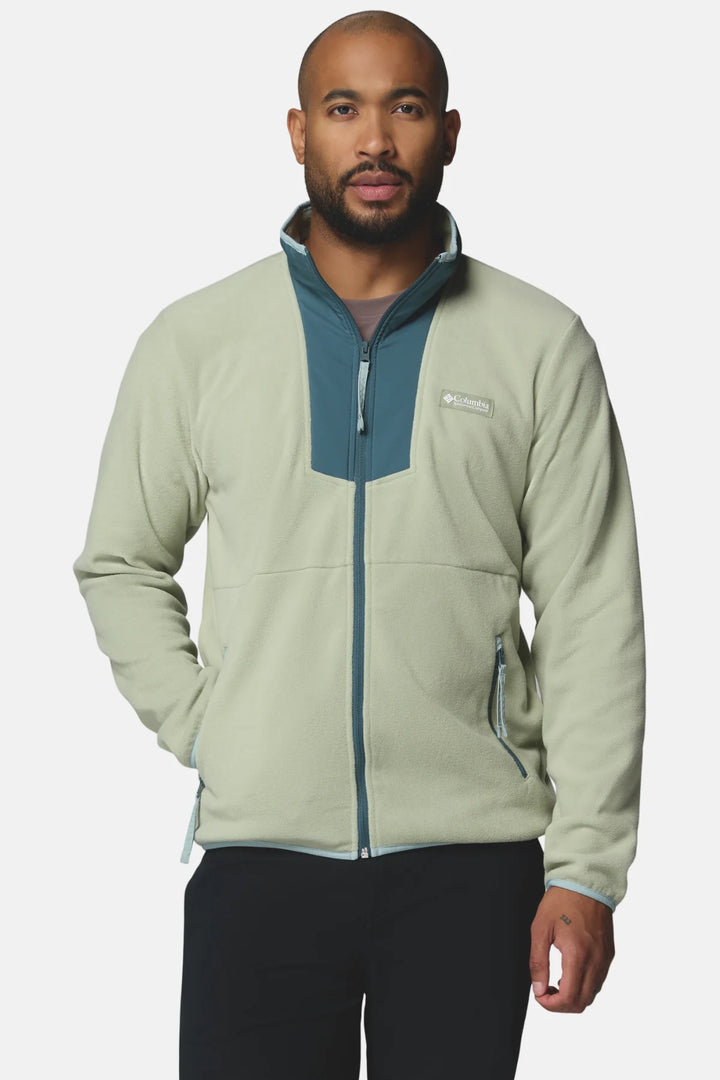 Light green full-zip fleece jacket with blue trim, stand collar, and zip pockets