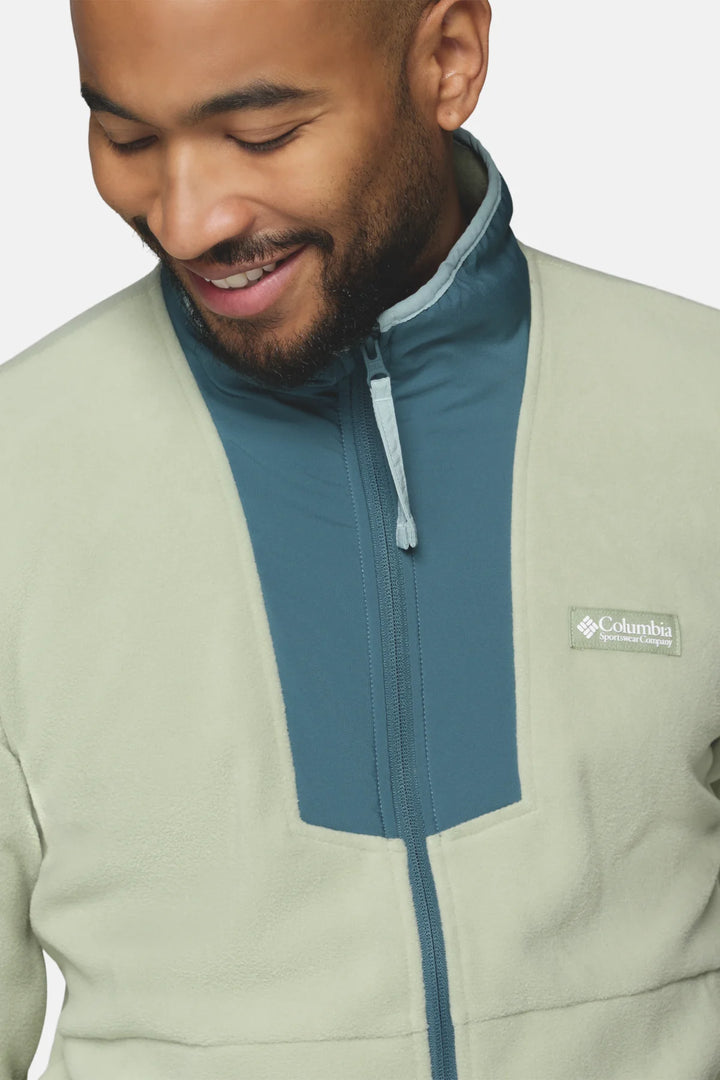 Light green fleece jacket with blue interior, stand collar, and zip front detail