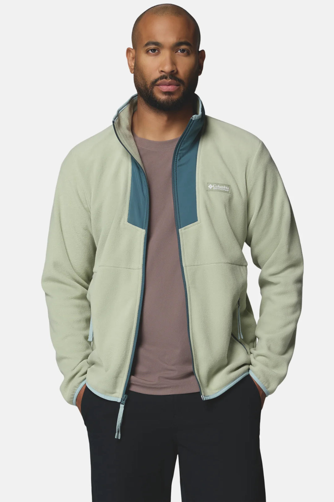 Light green full-zip fleece jacket with stand collar, blue zipper trim, and chest pocket