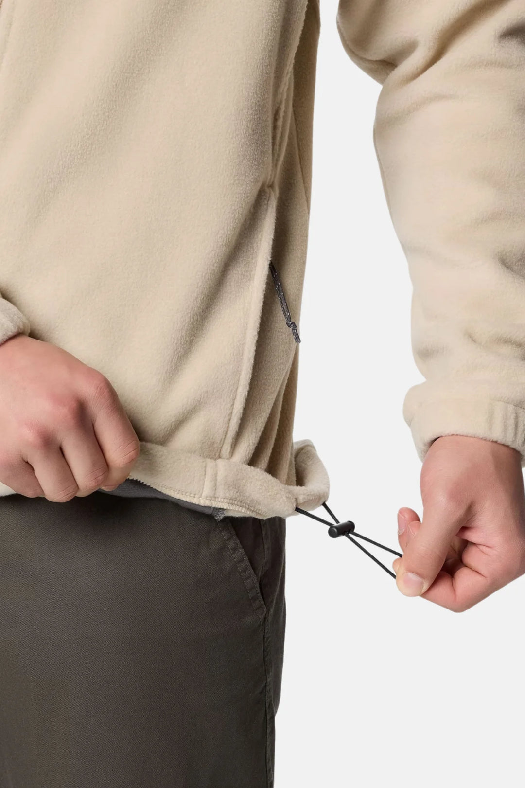 Beige fleece jacket with adjustable drawcord hem and zippered front