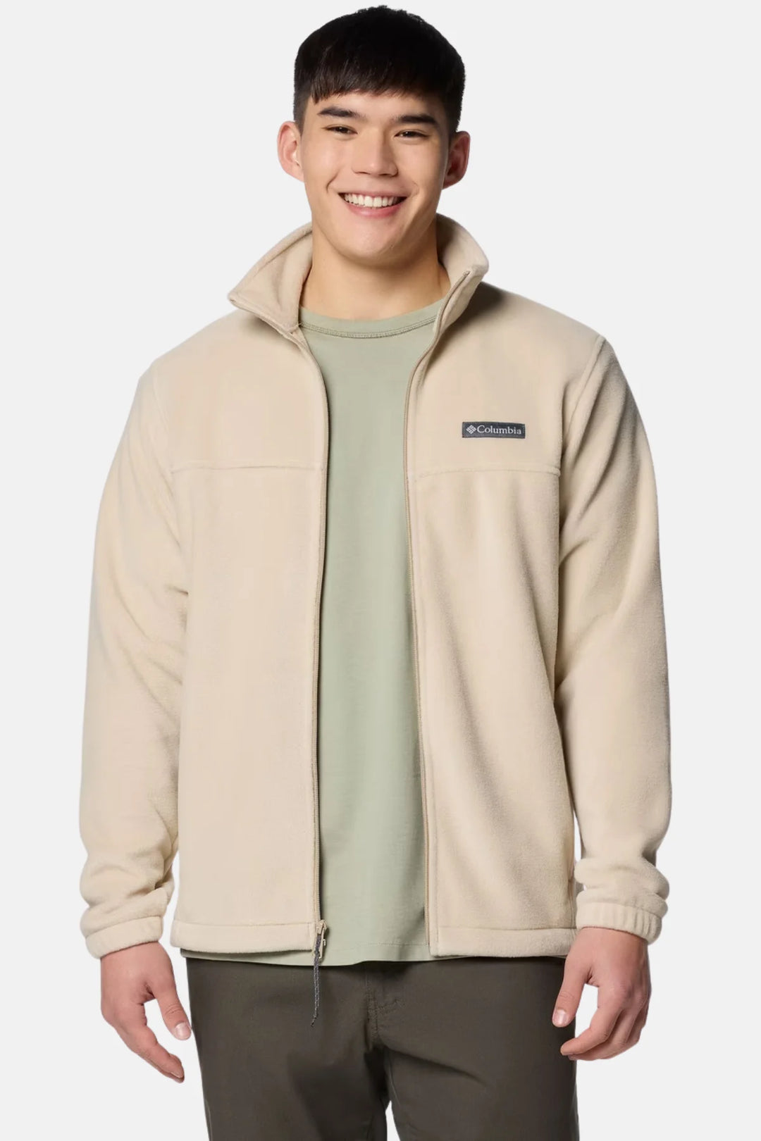 Beige fleece full-zip jacket on model with stand collar and zip front