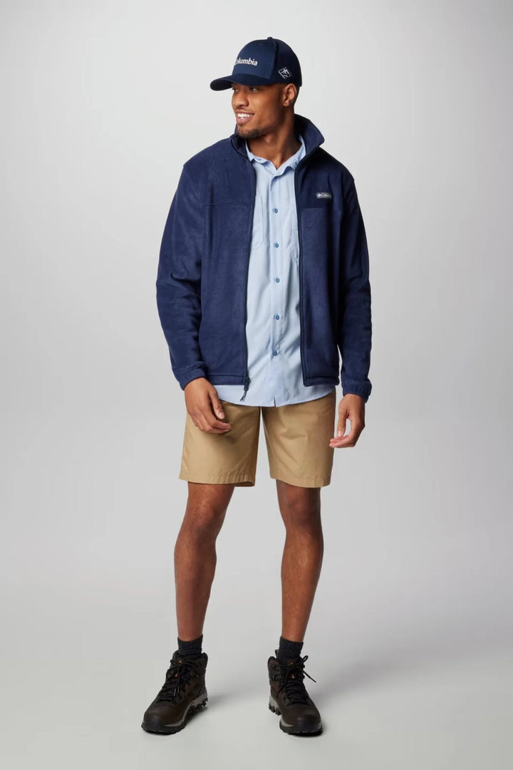 Columbia full-zip fleece jacket in collegiate navy, worn with beige shorts and cap