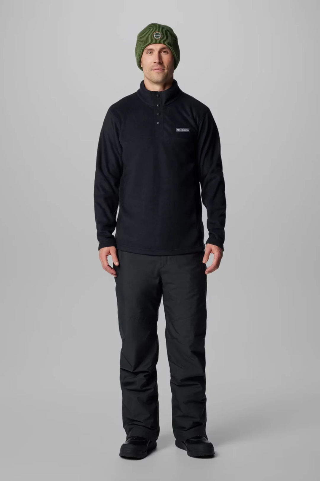 Men's black half-snap fleece pullover, front view with buttoned collar