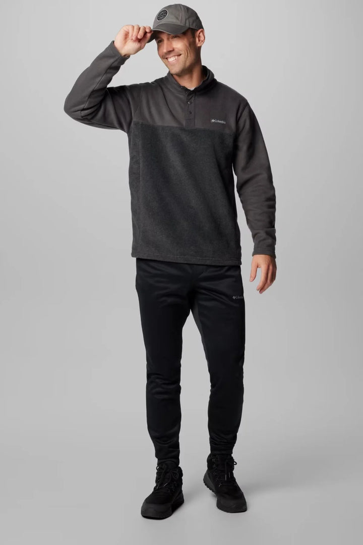 Charcoal heather half-snap fleece top worn with dark pants