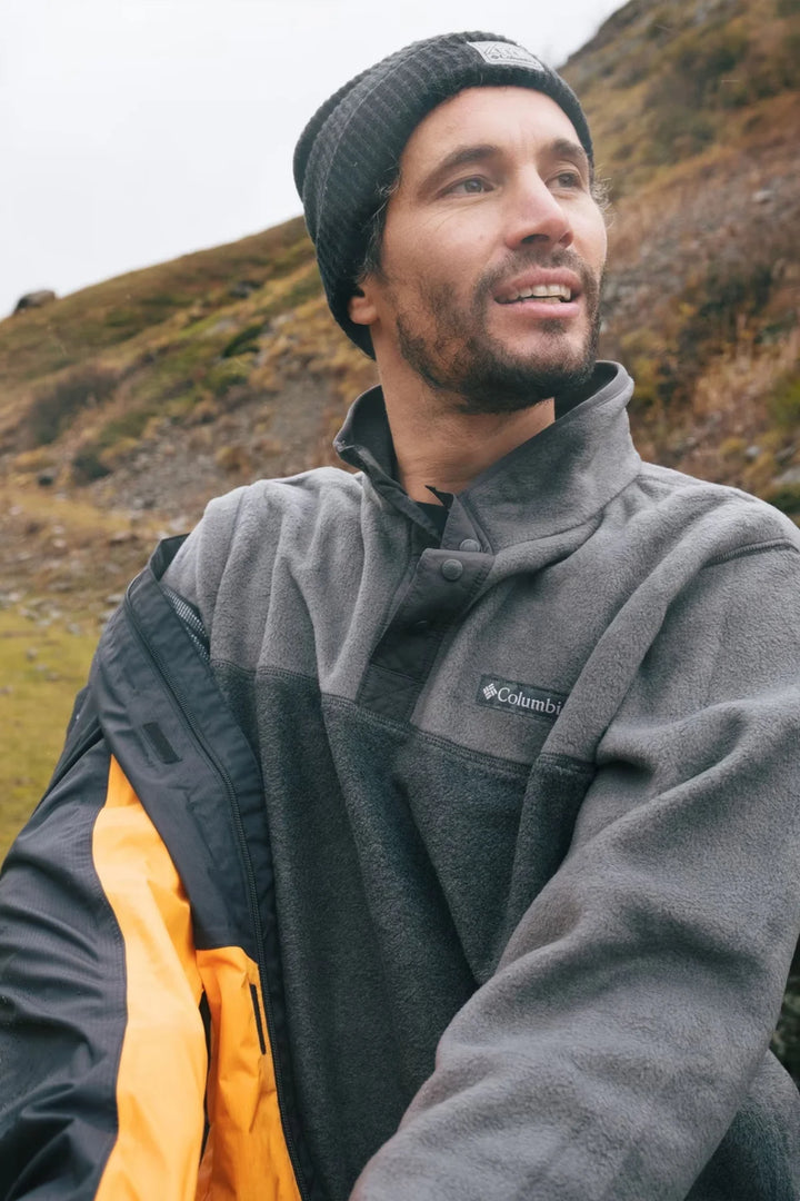 Charcoal fleece half-snap pullover with raised collar and Columbia logo at chest