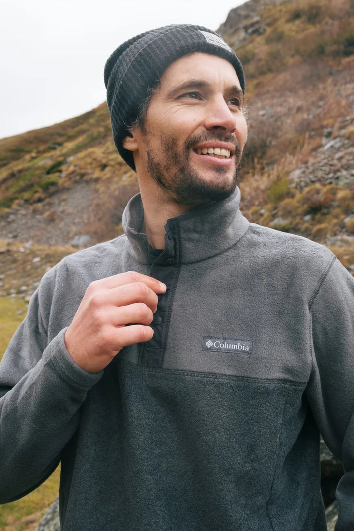 Charcoal fleece half-snap pullover with raised collar and Columbia logo detail