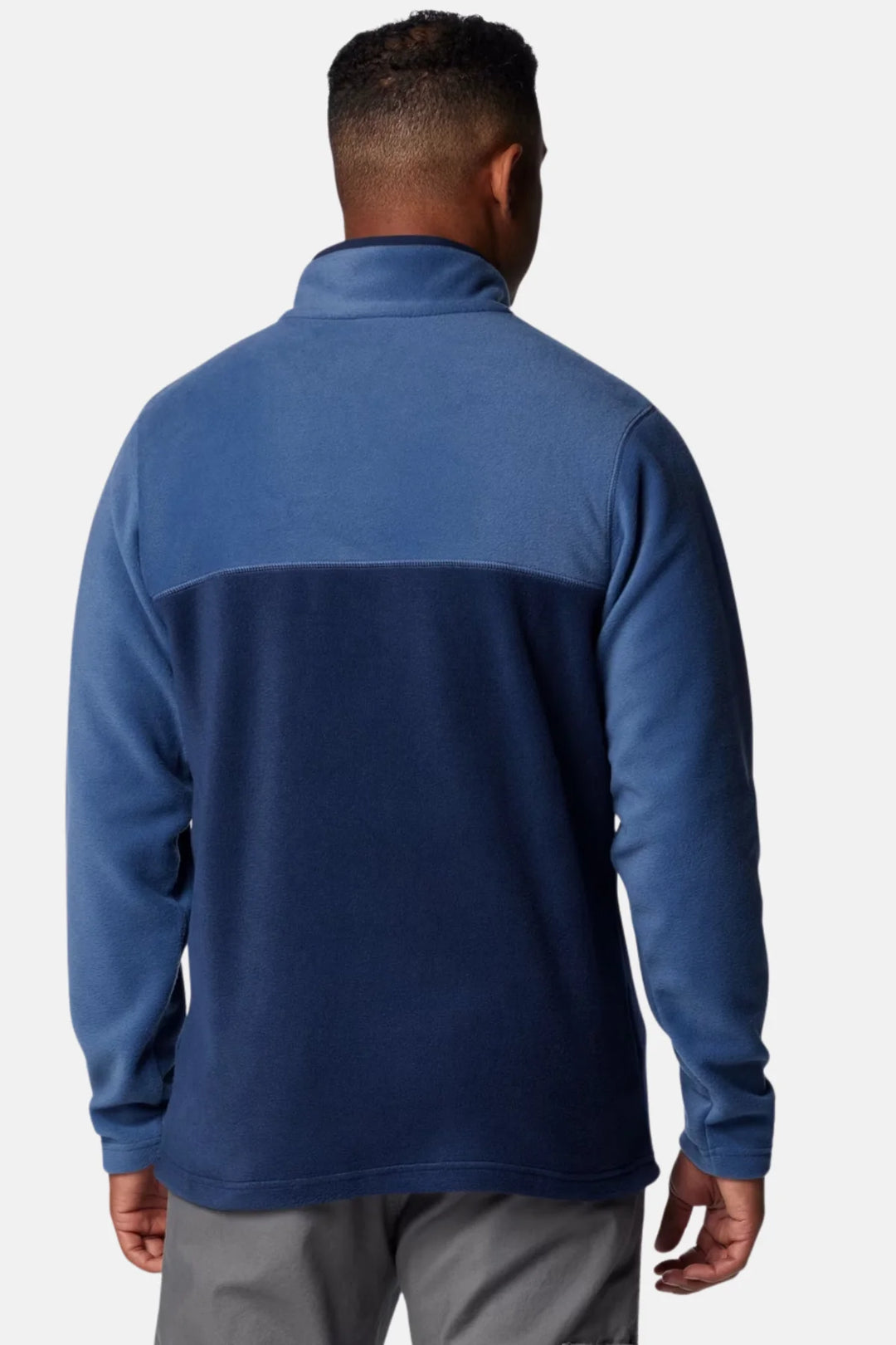 Men's blue fleece half-snap pullover back view with dark yoke panel