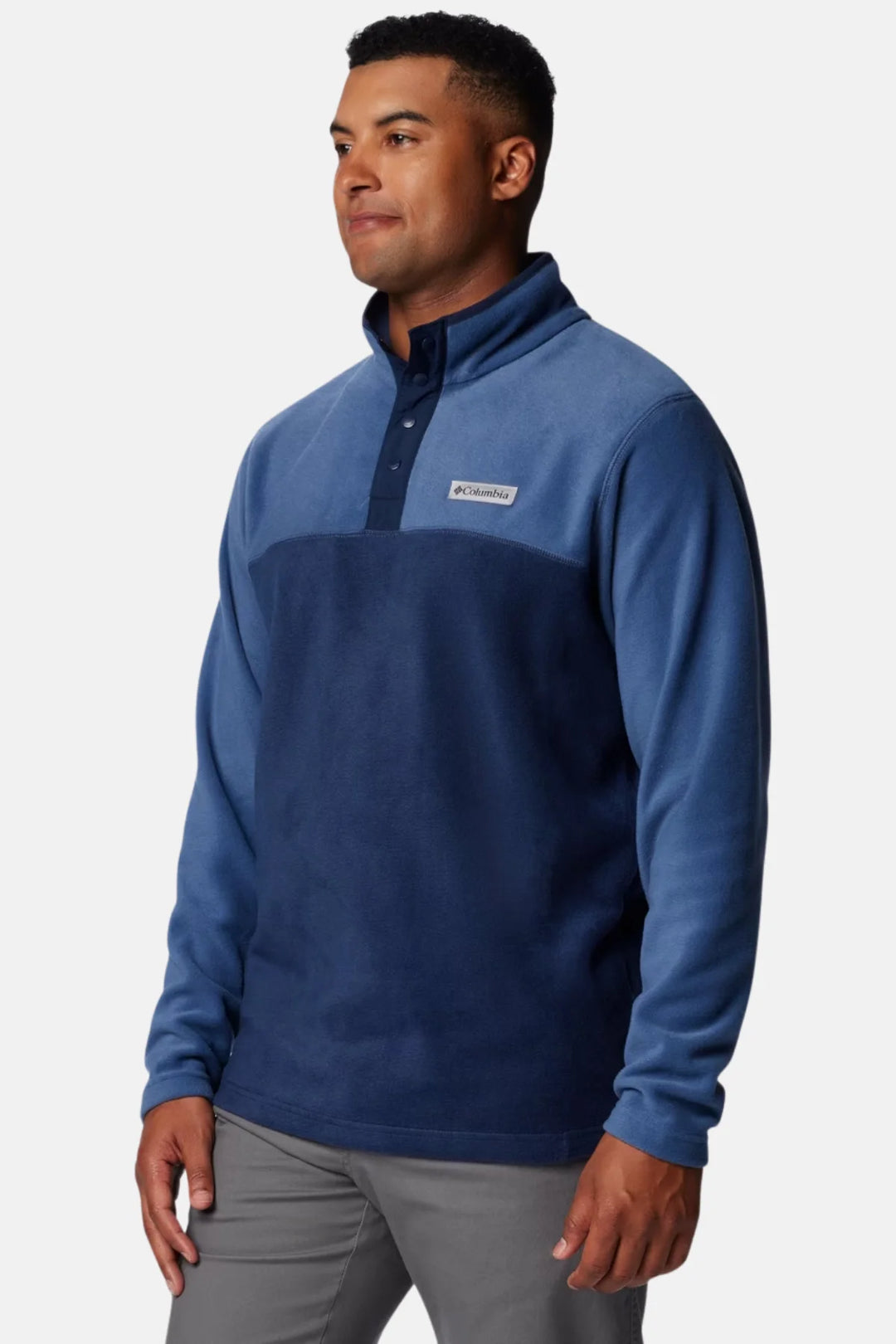 Men's blue fleece half-snap pullover with dark chest panel and long sleeves