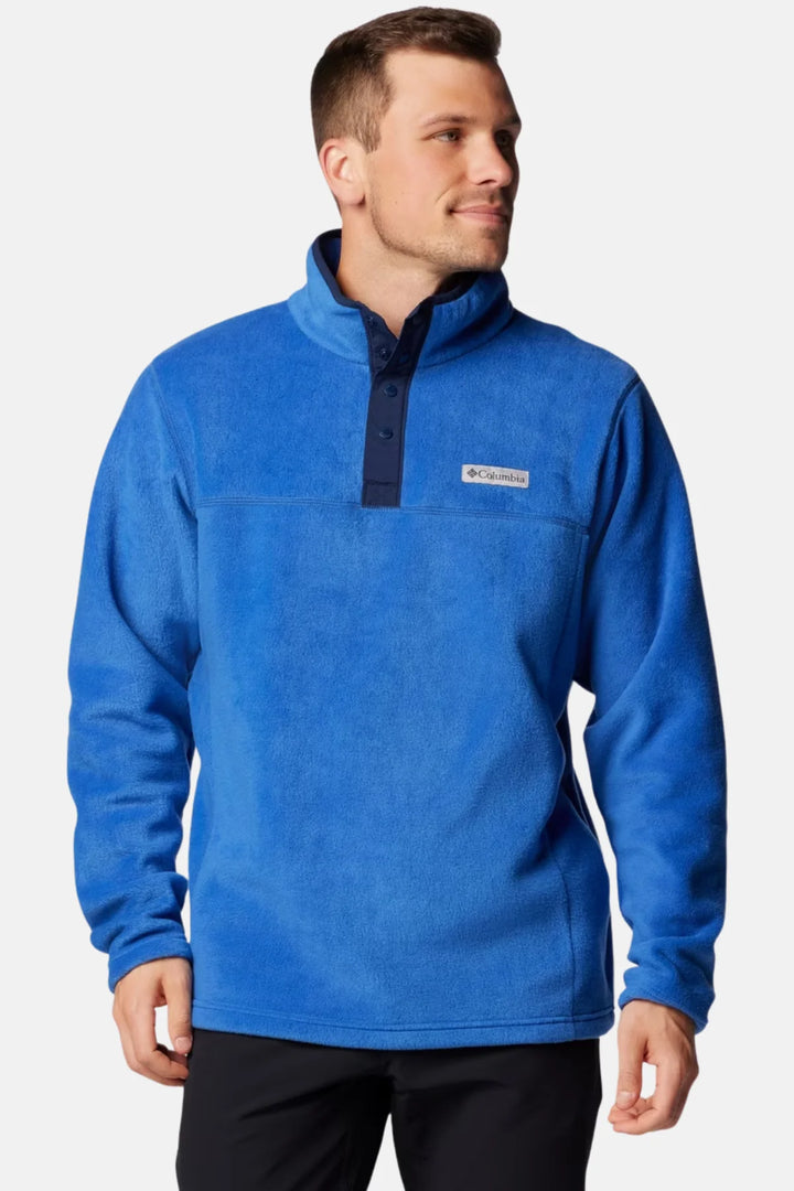 Men’s blue half-snap fleece top with stand collar and dark placket, chest logo