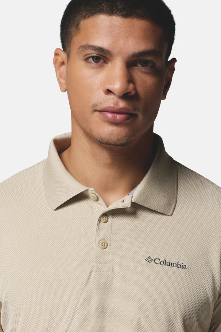 Men's light beige polo shirt collar and button placket with small Columbia logo