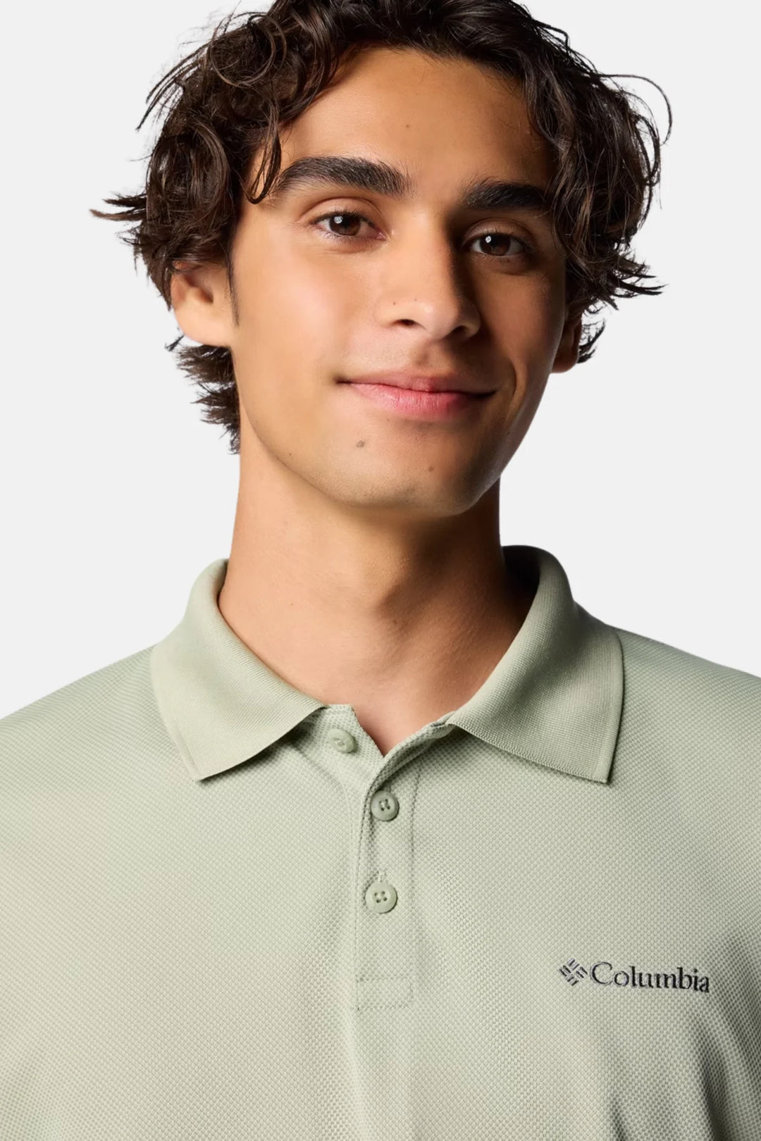 Columbia Utilizer polo shirt close-up with button placket and embroidered chest logo, sage green.