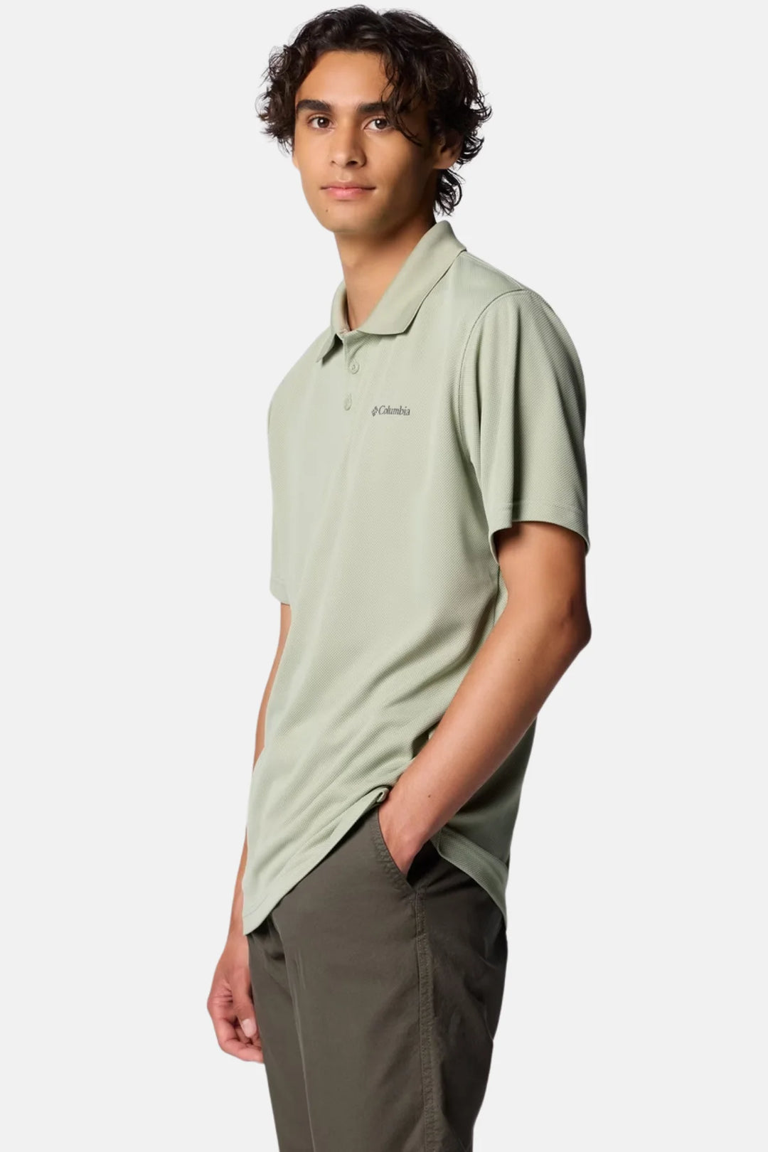 Sage green Columbia Utilizer polo shirt with short sleeves and chest logo, side view.