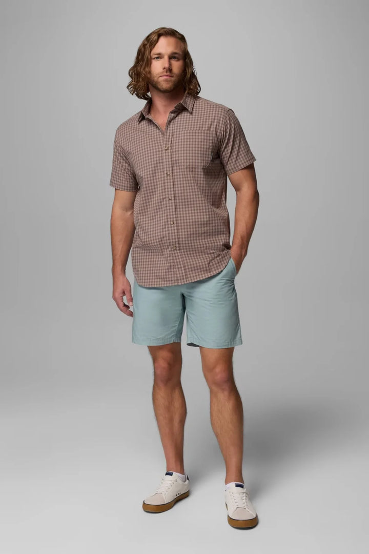 Light blue casual shorts worn by a model, knee-length