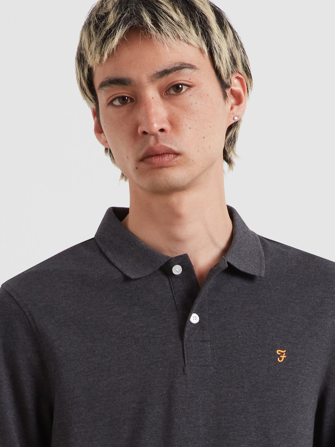 Washed black marl long-sleeve polo shirt with button placket and small chest logo.