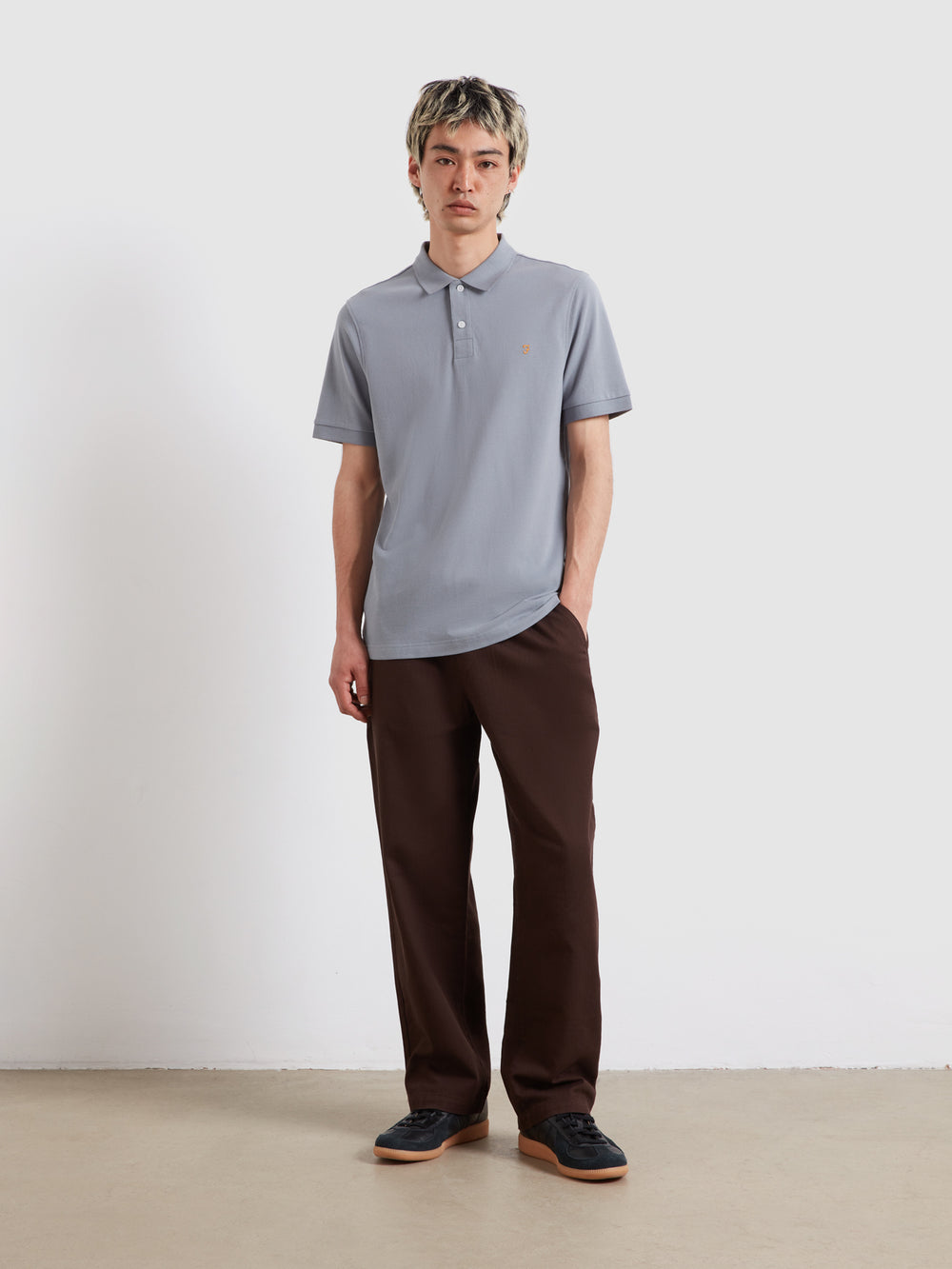 Light blue short-sleeve polo shirt with collared neckline and button placket