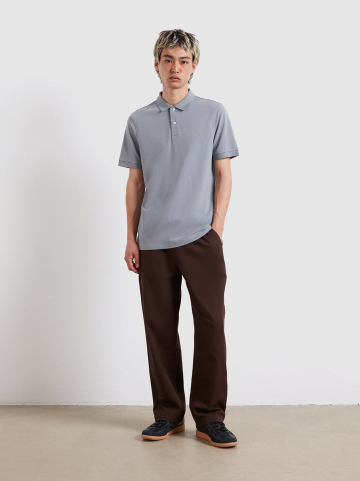 Light blue short-sleeve polo shirt with collared neckline and button placket