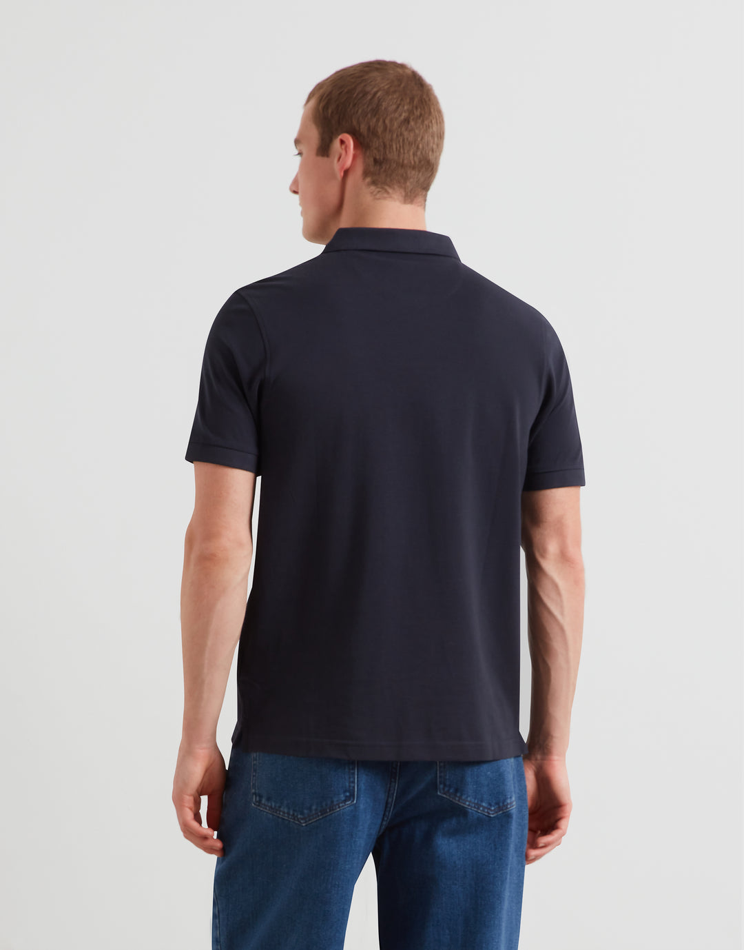 Men’s navy polo shirt back view with short sleeves