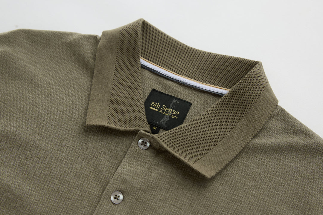 Brindle long-sleeve polo shirt collar with three button placket and 6th Sense neck label.