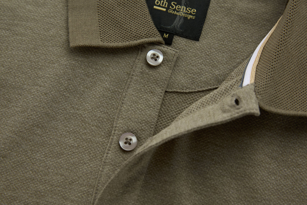 Brindle polo shirt neckline with button placket and contrast inner collar trim.