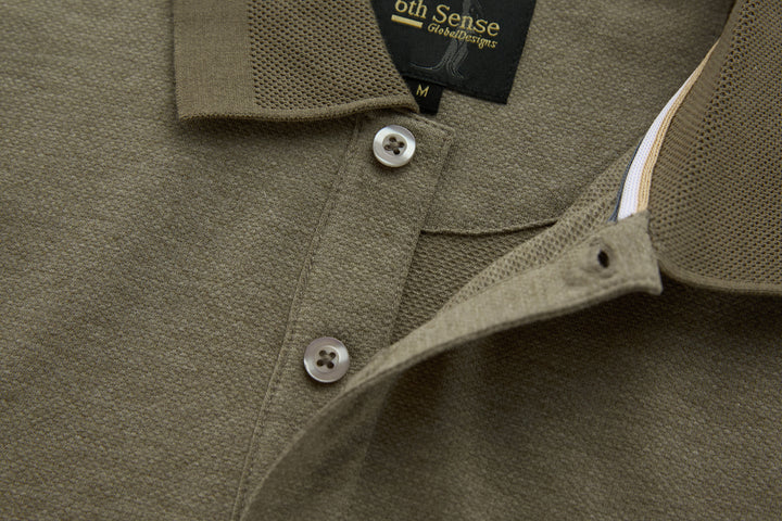 Brindle polo shirt neckline with button placket and contrast inner collar trim.