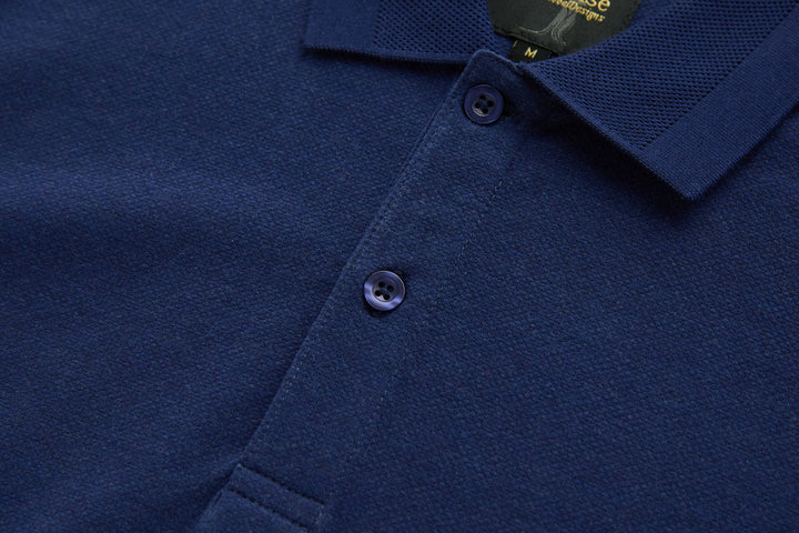 Dress blue polo shirt placket with two visible dark buttons