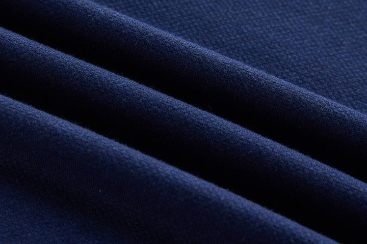 Dress blue long-sleeve polo shirt fabric close-up