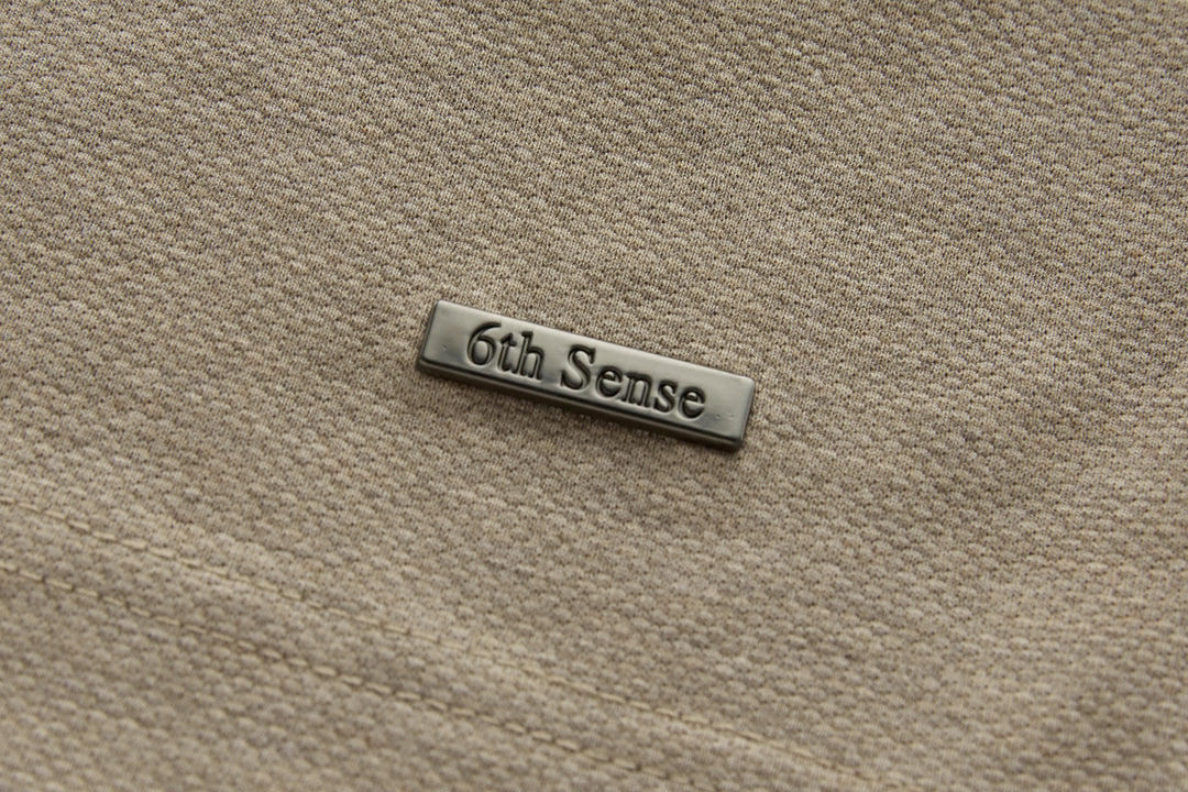 Beige long-sleeve polo shirt chest logo bar: 6th Sense.