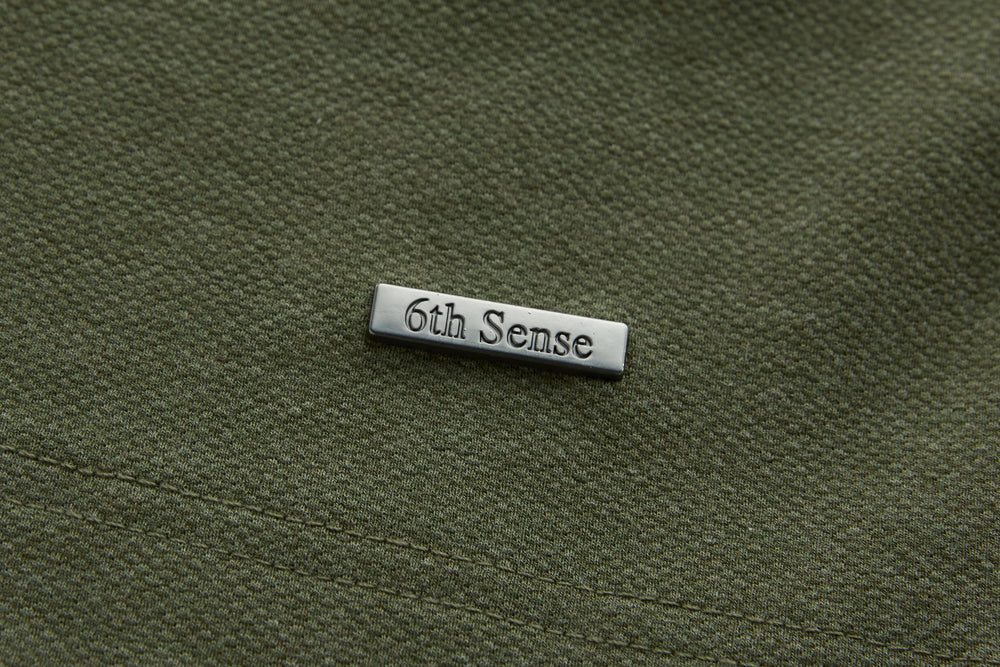 Olive long-sleeve polo shirt with 6th Sense logo patch