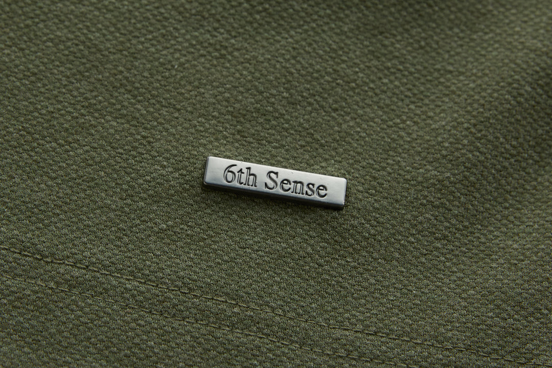 Olive long-sleeve polo shirt with 6th Sense logo patch