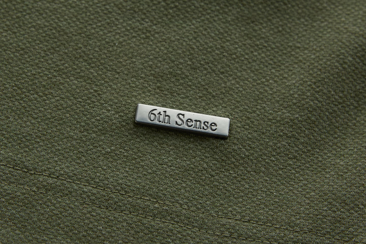 Olive long-sleeve polo shirt with 6th Sense logo patch