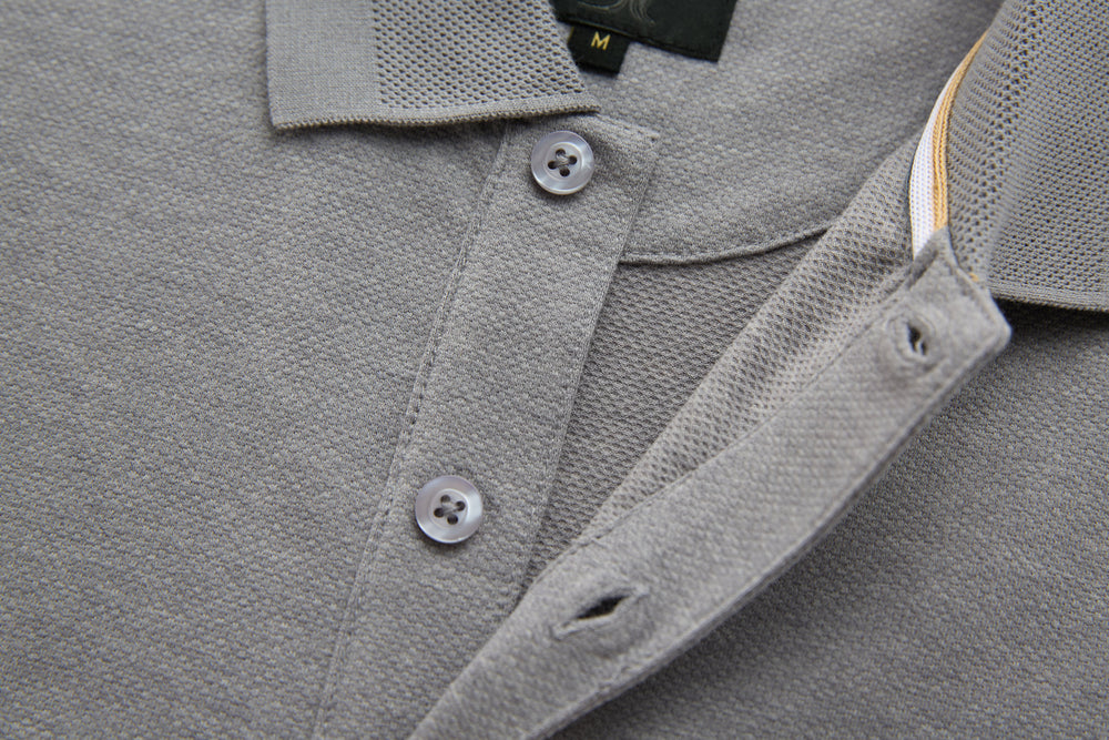 Light gray long-sleeve polo shirt with three buttons and spread collar.