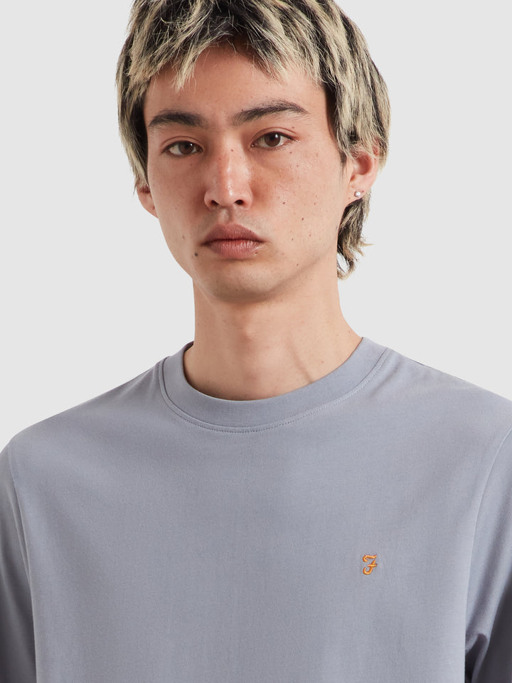 Men's light blue crew-neck T-shirt with small embroidered logo on chest