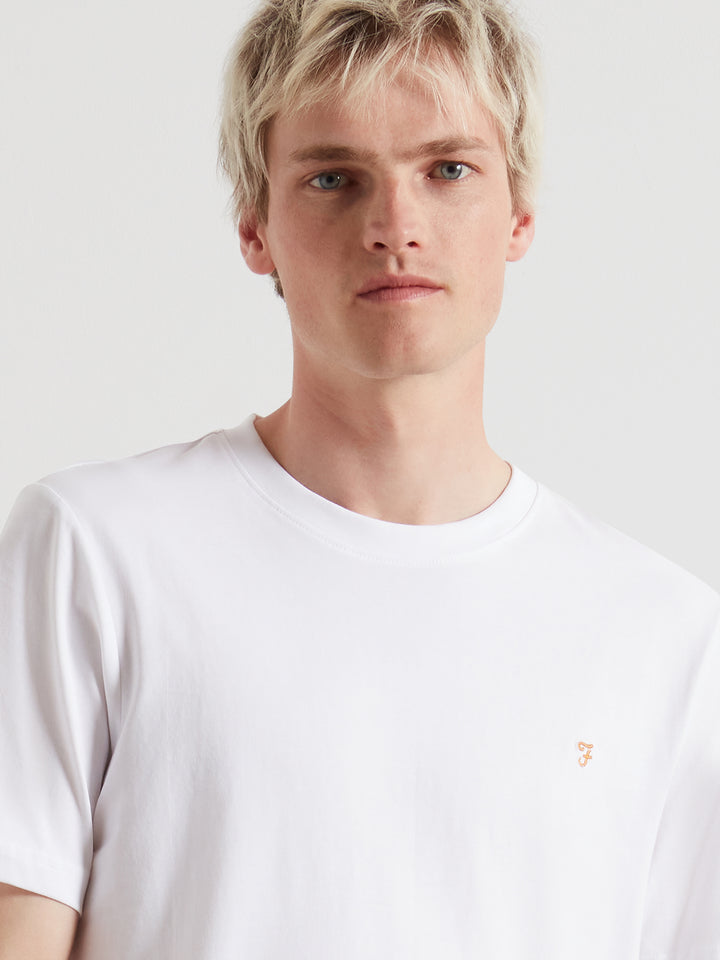 White crew-neck T-shirt with small Farah chest logo detail, close-up