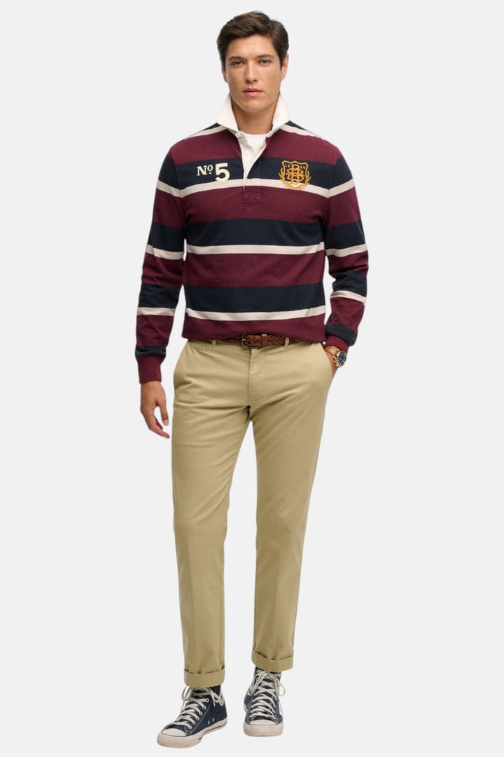 Men's port and navy striped rugby top with white collar and logo patches, long sleeves