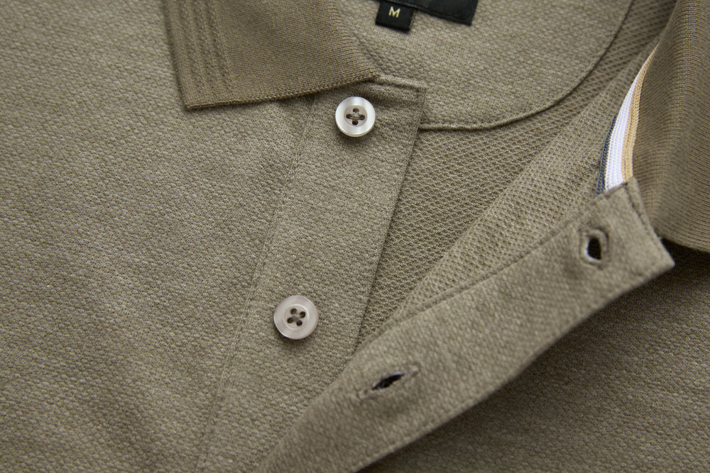 Olive polo shirt chest with button closure and curved side seam