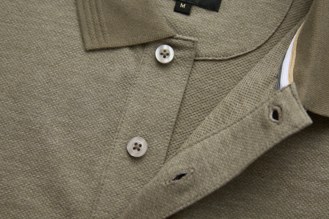 Olive polo shirt chest with button closure and curved side seam