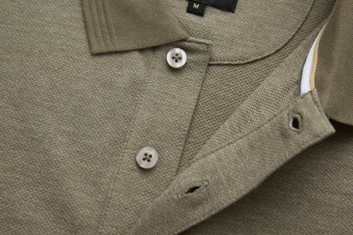 Olive polo shirt chest with button closure and curved side seam