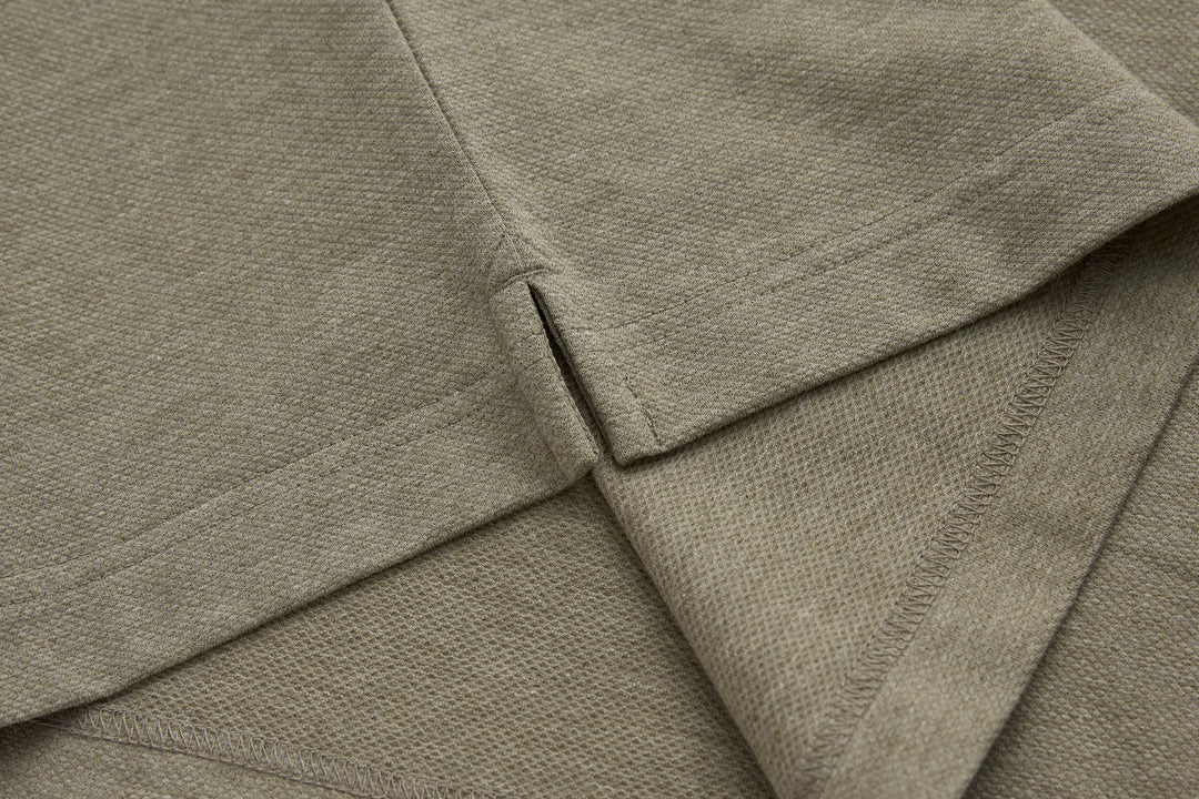 Olive polo shirt collar and placket seam detail