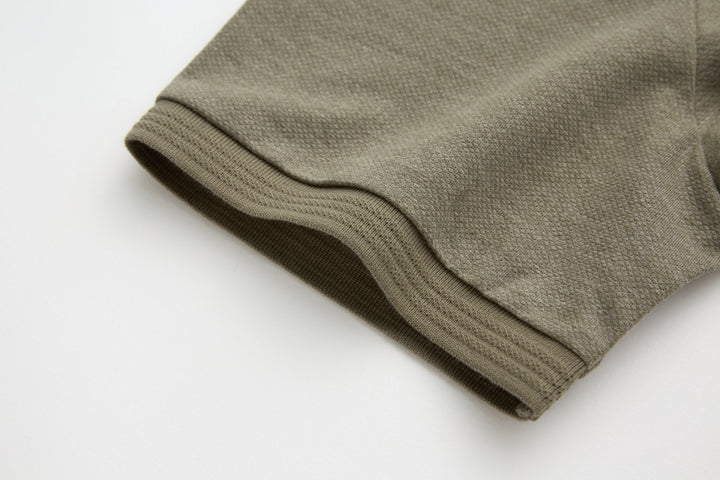 Olive polo shirt sleeve cuff with ribbed edge
